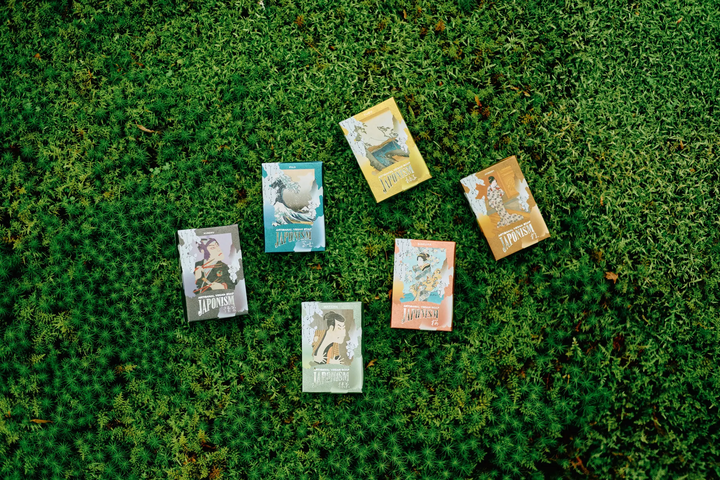 Six JAPONISM soaps wrapped in ukiyo-e, resting on moss